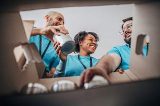 volunteers-pack-canned-food-donations