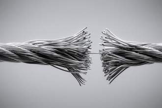 wire rope being pulled apart with only one strand holding them together