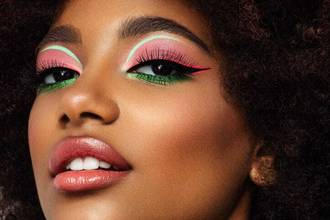 woman looking into the camera with glamorous makeup