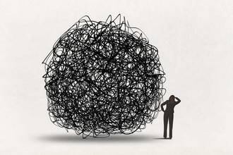 woman looks past confusion in the shape of a large scribbled ball
