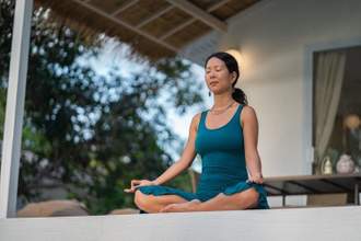 woman meditating at home