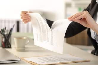 woman tearing up contract