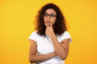 woman thinking with hand on chin