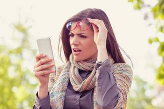 woman upset by something on her phone