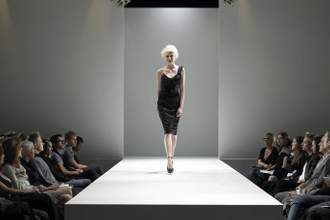 woman walking down the catwalk