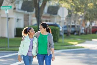 woman walking with daughter