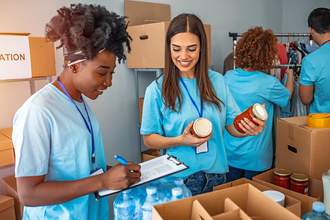 women working on donation boxes