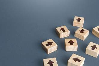 wood blocks with arrows in all directions