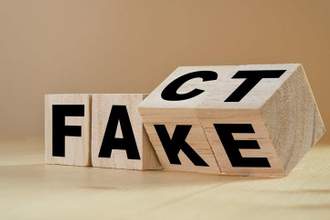 wooden box flipping from the word fake to the word fact