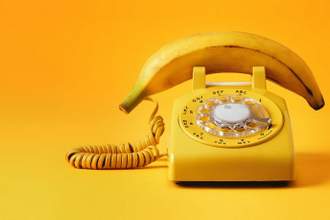 yellow dial up phone where the phone is a banana