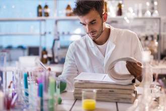 young scientist reading scientific data in a laboratory