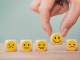 a series of wooden blocks with emoji style emotions