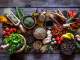 a table filled with colorful herbs and spices